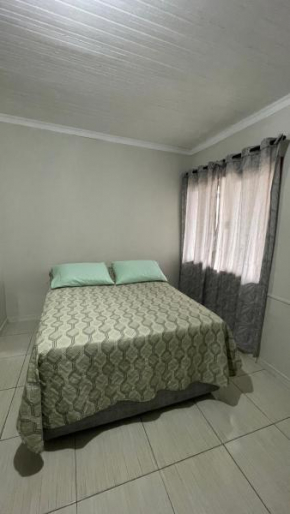 Quarto casal em casa compartilhada